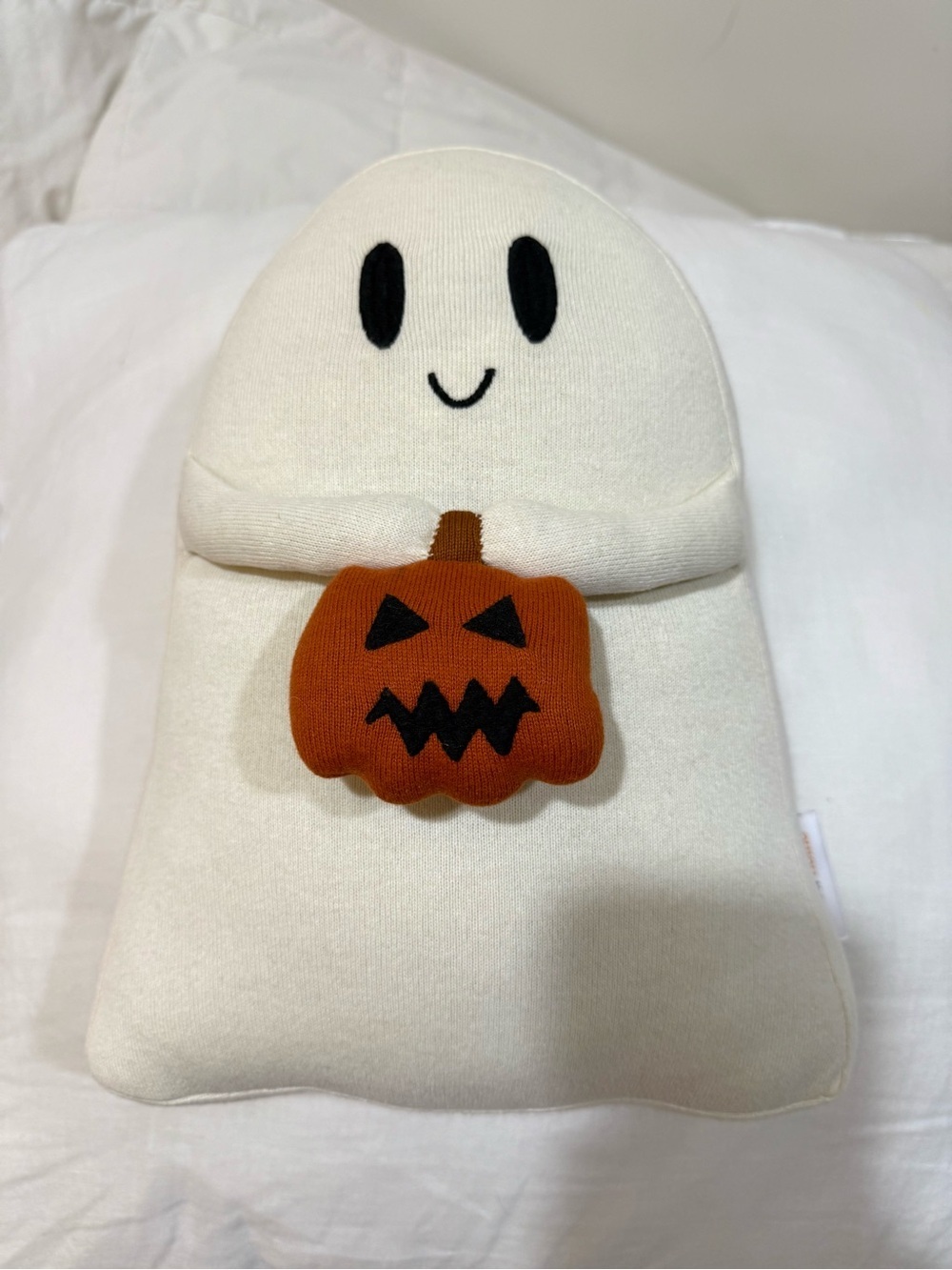 Cream Ghost Holiday Pillow with Orange Pumpkin Accent